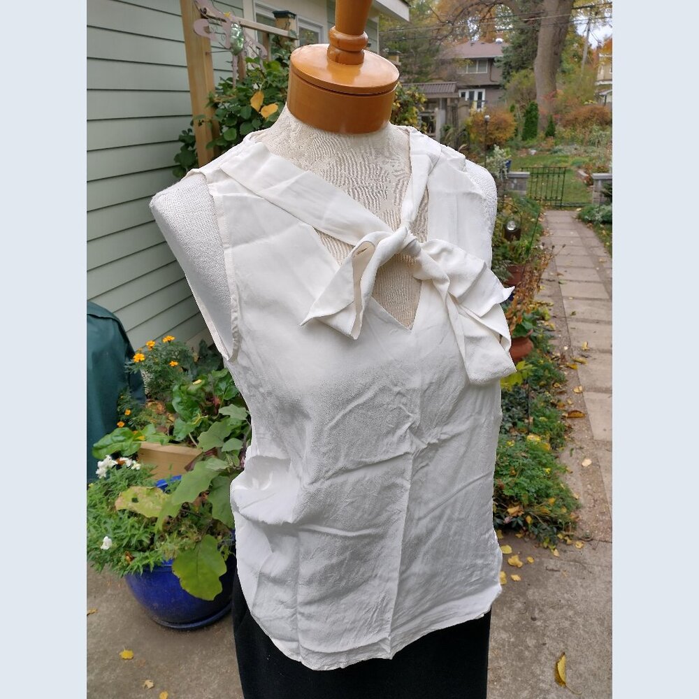 Blouse: Silk, off-white, sleeveless, attached bow tie. Size 6 - by Ralph Lauren